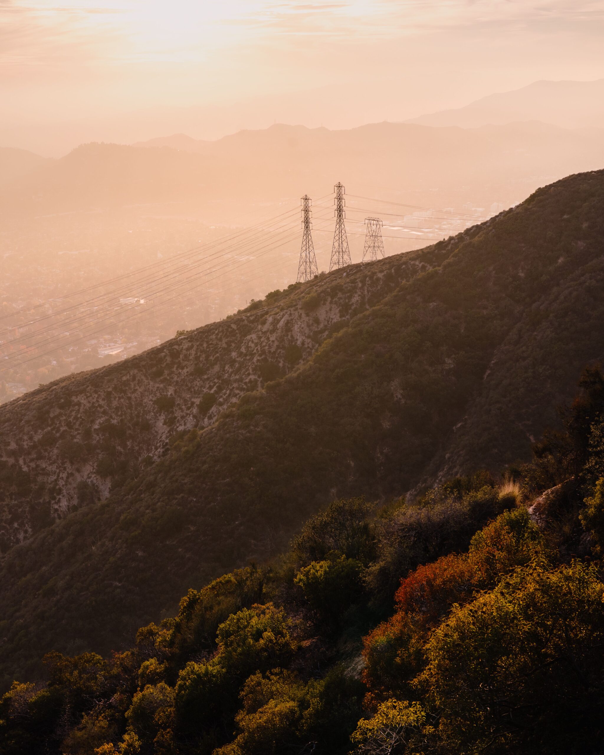 stonishing sunset photography of transmission towers on top of the hill at San Gabriel Mountain in the Angeles National Forest